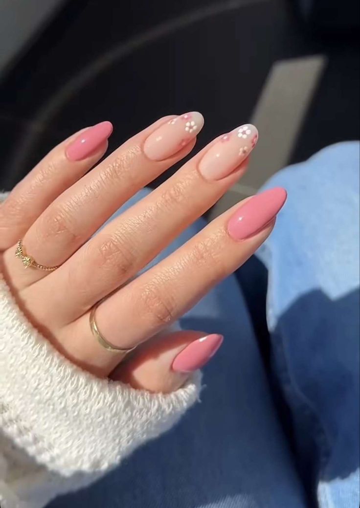 Sophisticated Soft Pink Nail Design with Floral Accents and Modern Finish.