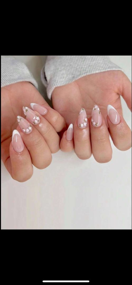 Sophisticated Floral French Tip Nail Design on Soft Nude Base.