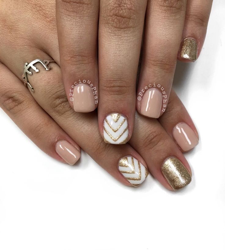 Sophisticated Nail Design: Neutral Base with Glamorous Gold Accents