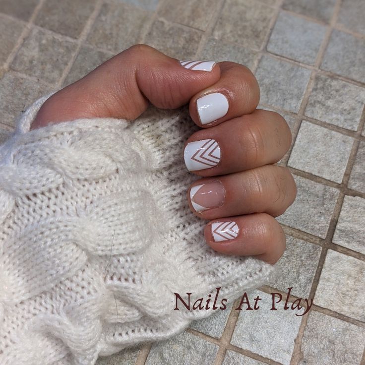 Modern Geometric Nail Design: White Base with Soft Angular Patterns for an Elegant Playfulness.