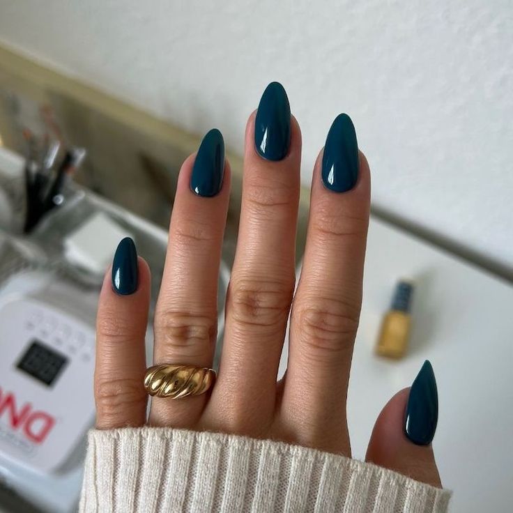 Chic Teal Almond-Shaped Nails: A Glossy Finish for Modern Elegance.