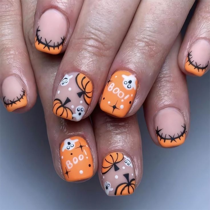 Whimsical Halloween Nail Art: Playful Orange and Nude Design with Ghost and Pumpkin Illustrations