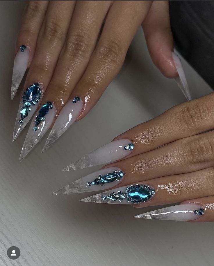 Elegant Long Stiletto Nails with Clear and Ombre Designs Enhanced by Shimmering Blue Gems