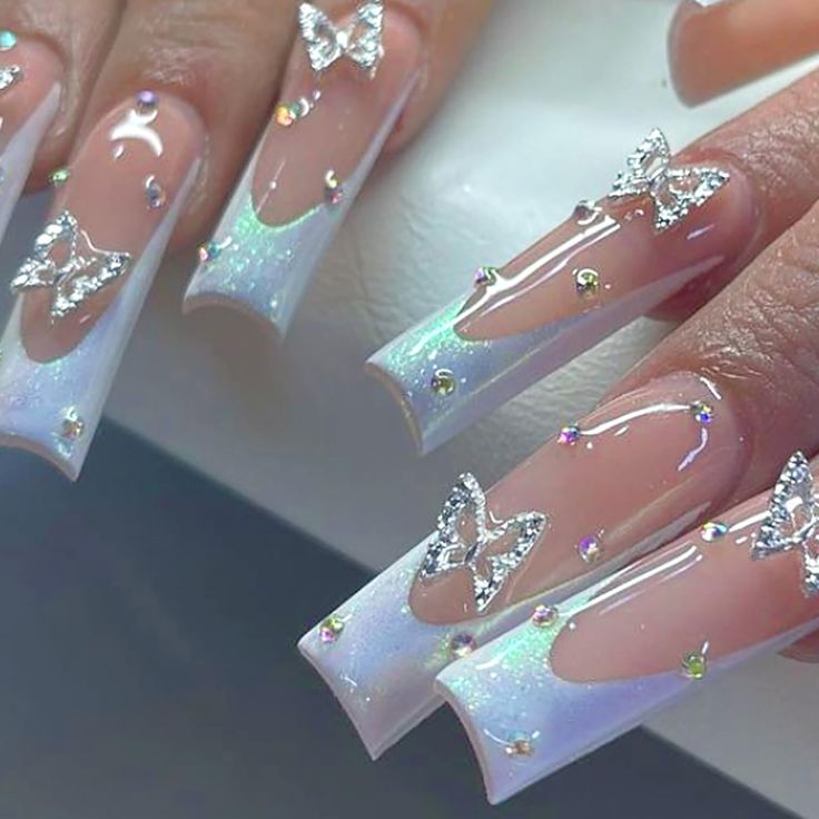 Elegant Iridescent Coffin Nail Design with Butterfly Embellishments and Rhinestones