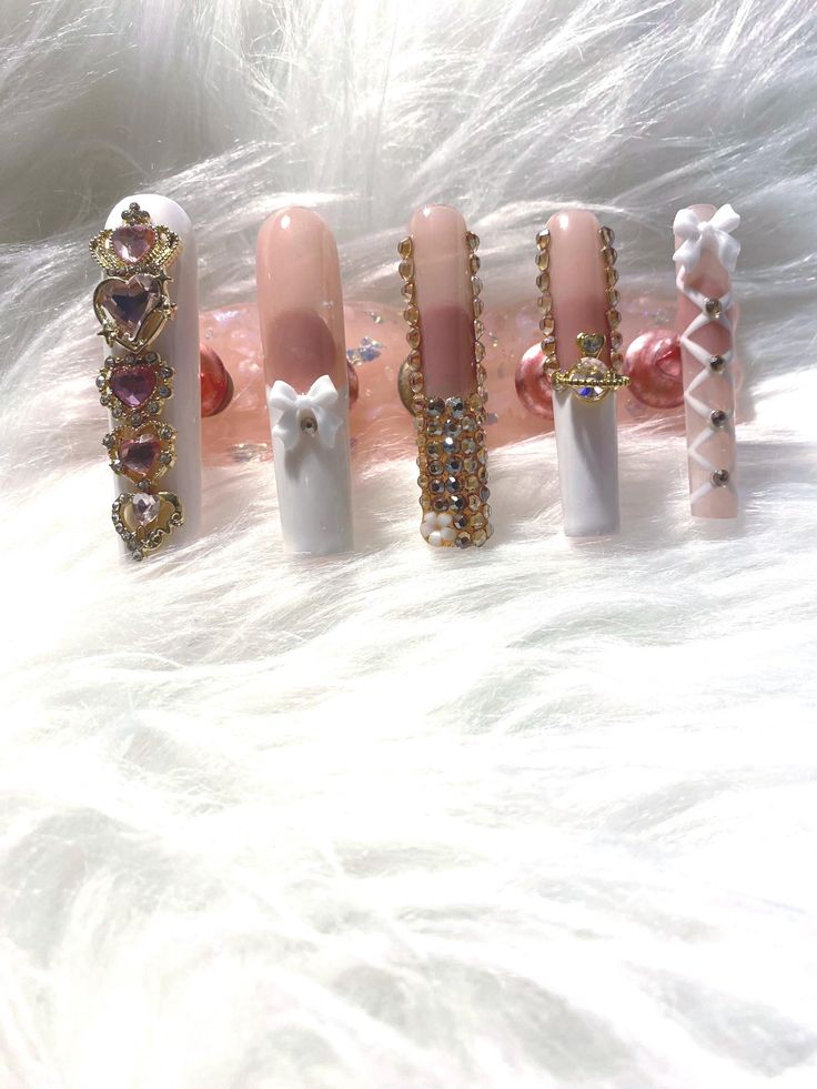 Playful Elegance: Intricate Nail Designs with Glamorous Embellishments.