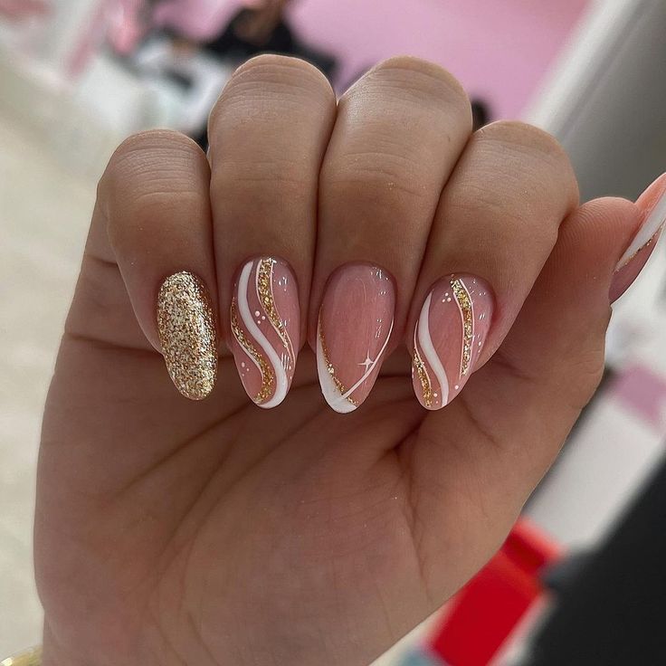 Chic Pink and White Nail Design with Whimsical Swirls and Glitter Accents.