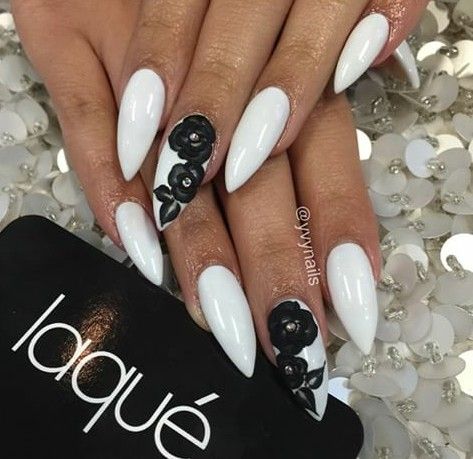 Striking Nail Design: Pristine White Base with Intricate Black Floral Artistry