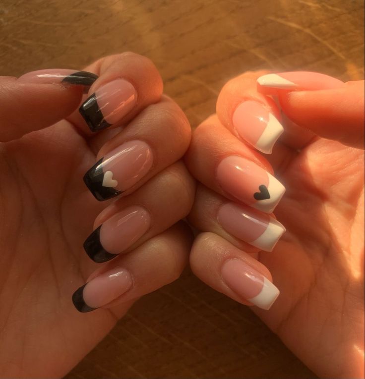 Chic Nail Design: Classic French Tips with Playful Heart Accents