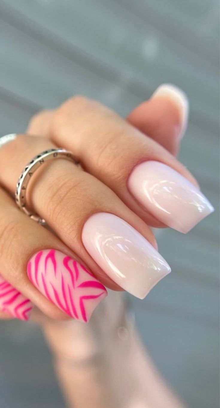 Vibrant Zebra Accent Nail Design with Elegant Nude Base