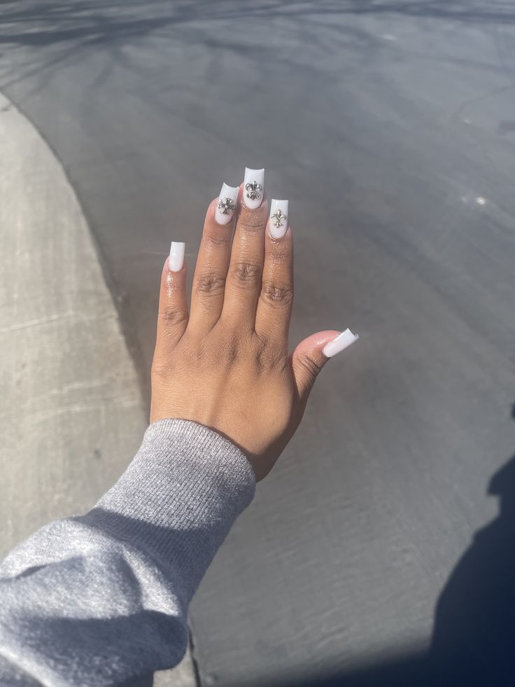 Sleek White Base Long Acrylic Nails with Elegant Nail Art Accents for a Bold, Sophisticated Statement.