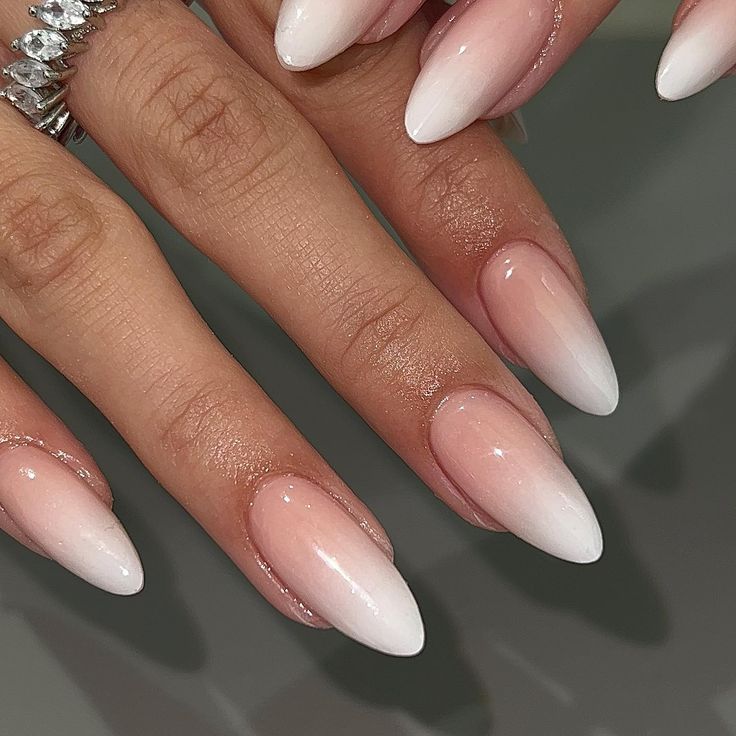 Elegant Ombre Nails: Chic Gradient from Soft Pink to Pristine White Tips in Almond Shape.