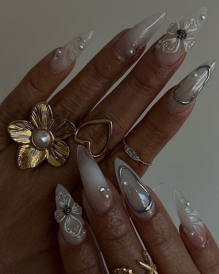 Whimsical Elegance: Sophisticated Nail Design with Floral Accents and Shimmering Details.