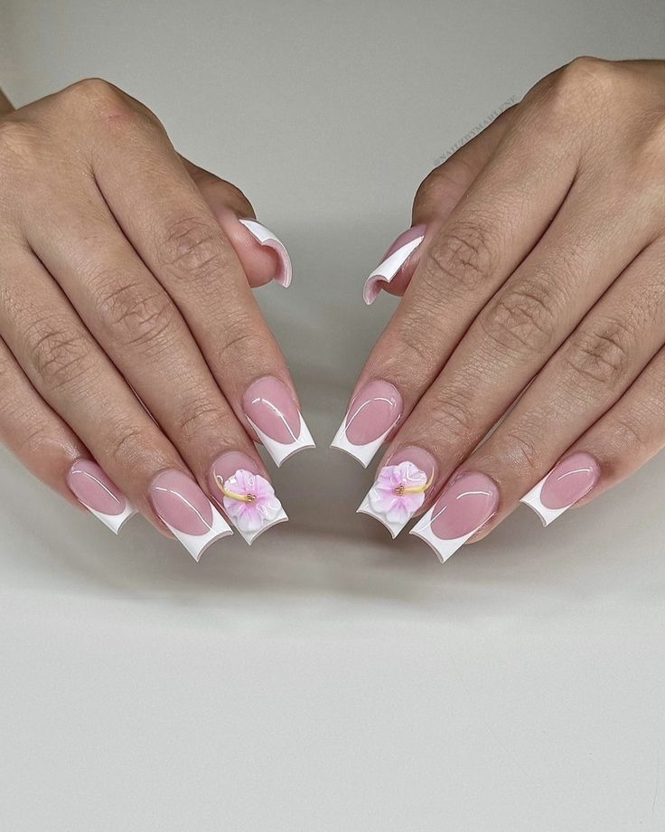 Chic Nail Design: Blending Soft Pink and White with Floral Accents for a Modern French Tip Look