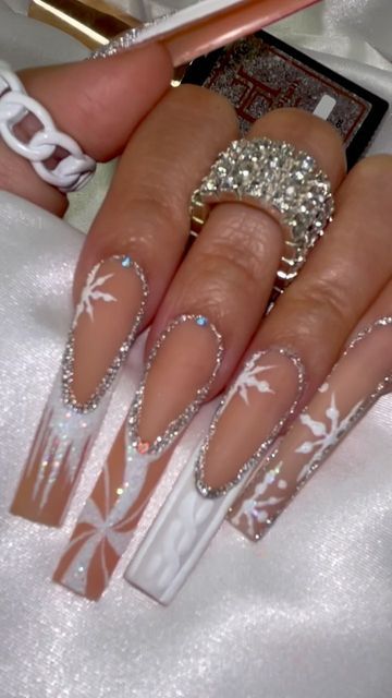 Elegant Acrylic Nail Designs with Intricate Patterns and Sparkling Embellishments