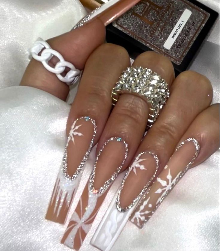 Elegant Nail Design with Intricate Patterns and Glamorous Accents.