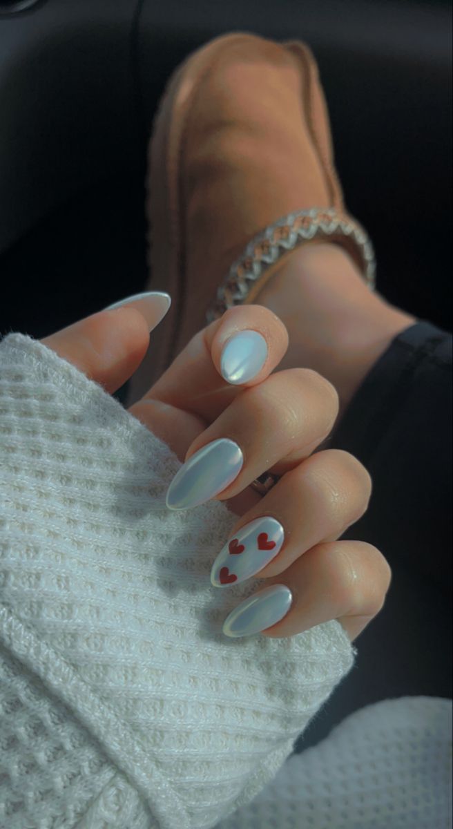 Elegant Nail Design with Glossy White, Iridescent Finishes, and Playful Red Hearts