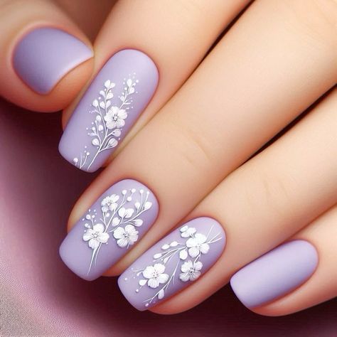 Elegant Hand-Painted Floral Nail Design on Soft Lavender Background with Matte Finish.