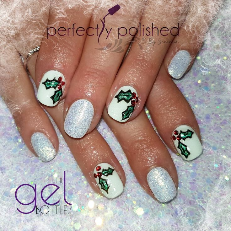 Elegant Festive Nail Design with Shimmering Silver, Classic White, and Cheerful Holly Leaf Art.