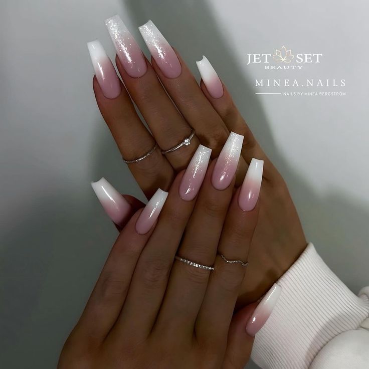 Chic Elegant Ombre Nails: Soft Pink Fades to White with Sparkling Glamour.