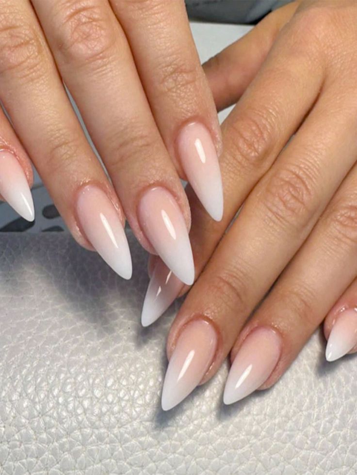 Chic Almond-Shaped Ombre Nails: Elegant Gradient from Nude to White.