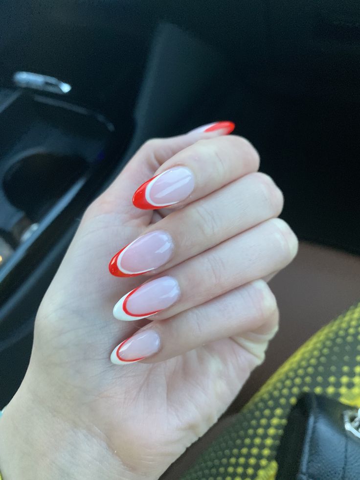 Chic Red-Tipped Nails: Bold Design with Playful White Contrast