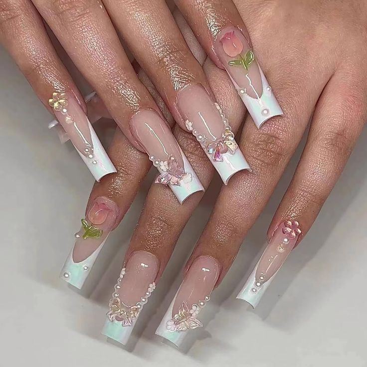 Whimsical Sophistication: Elegant Pastel Nail Art with Floral Designs and Intricate Details.