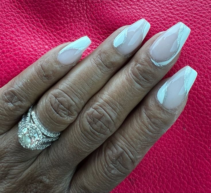 Sophisticated Almond-Shaped Nails with Elegant White Finish and Accent Lines