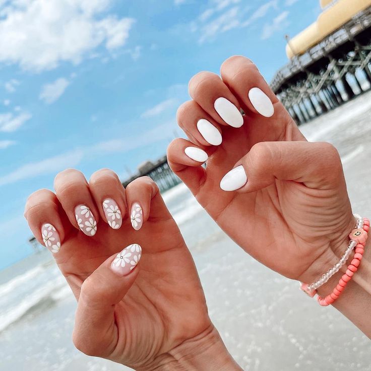 Elegant White Floral Nail Design for a Breezy Beach Look