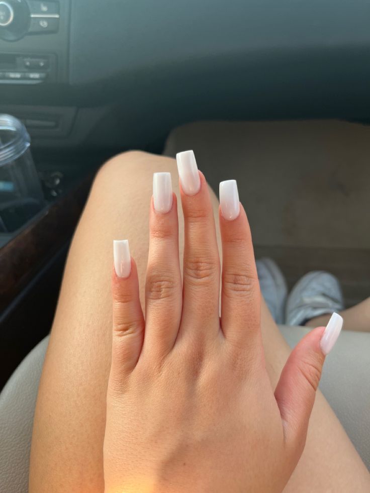 Elegant Soft White Acrylic Nails: A Polished and Minimalist Design.