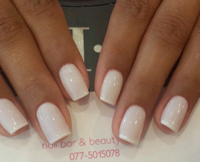 Elegant Minimalist White Nail Design with Subtle French Tip