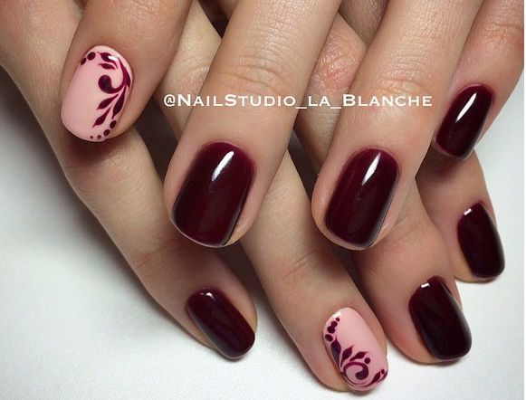 Sophisticated Elegant Nail Design: Burgundy Base with Floral Pink Accent.