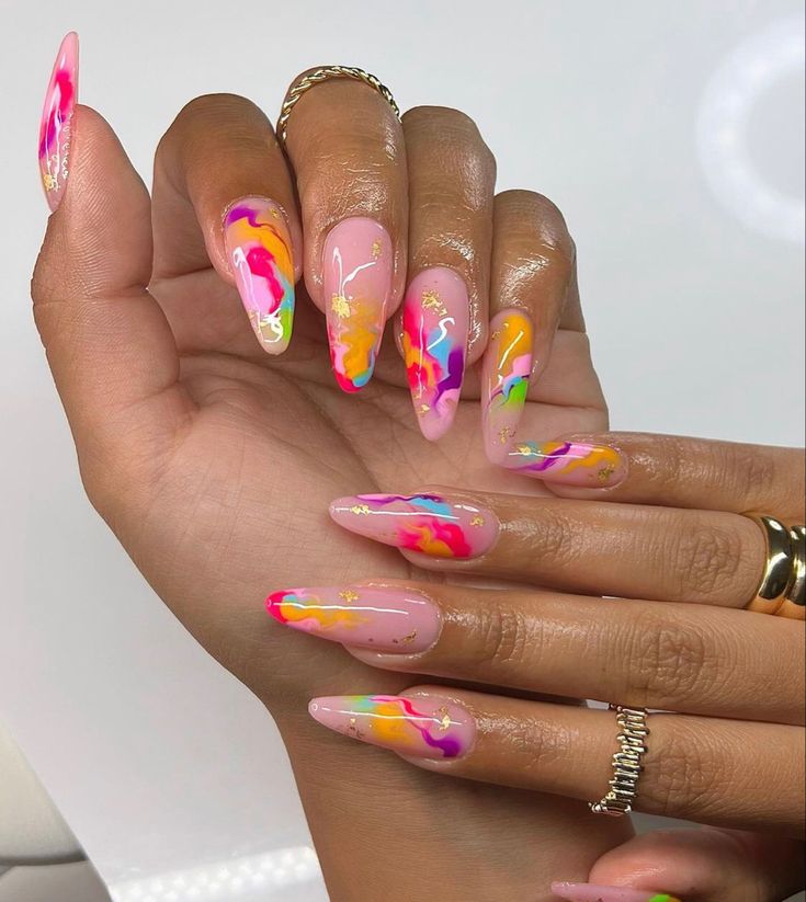 Vibrant Marbled Nail Art: Playful Elegance with Metallic Accents.