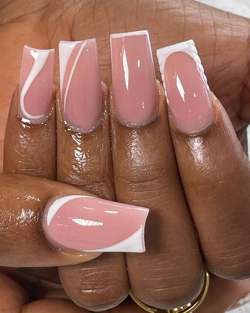 Elegant Soft Pink Nail Design with White Accents and Glossy Finish.