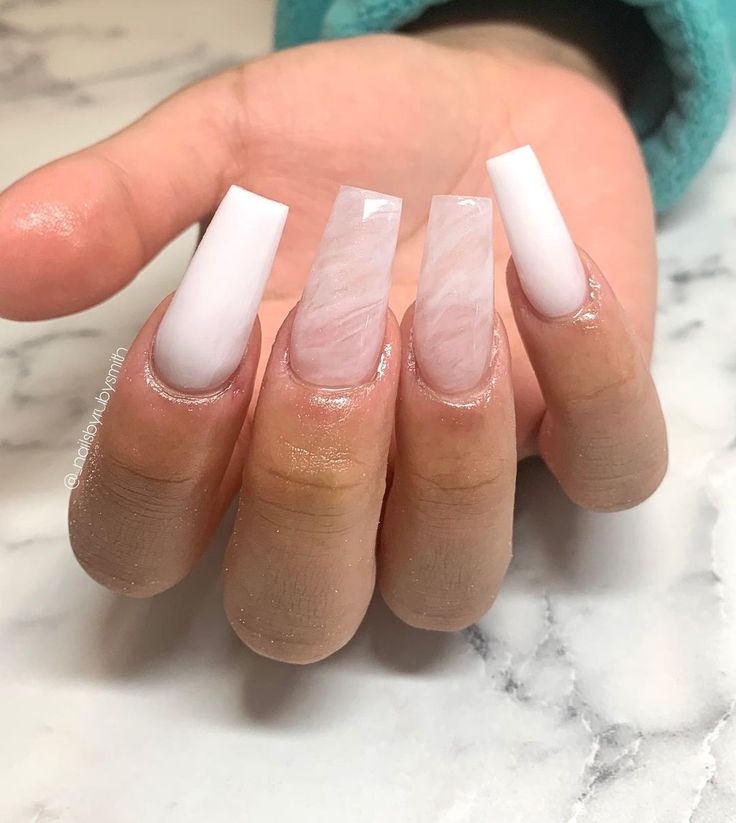 Chic Marble-Inspired Nail Design with Glossy White Accents.