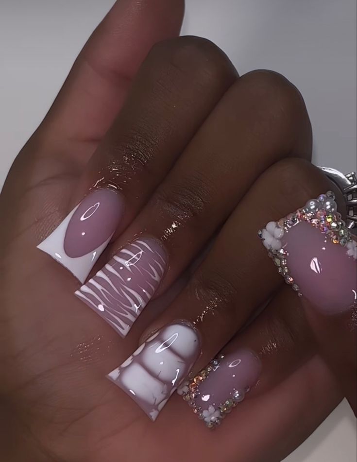 Chic Elegant Nail Design with Soft Pinks, White Accents, and Glamorous Embellishments.