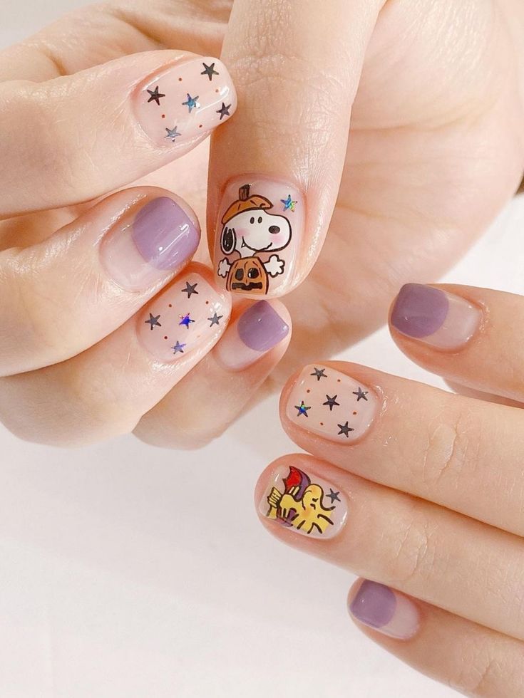 Whimsical Nail Design with Colorful Character Accents and Sparkling Stars