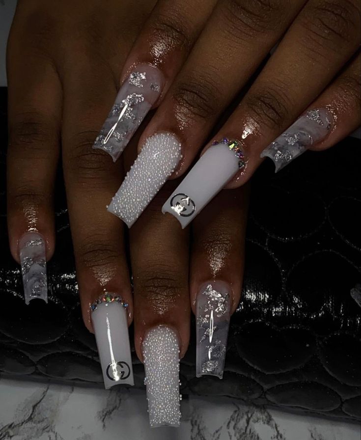 Chic and Sophisticated Stunning Nail Design with Glossy White and Clear Elements.