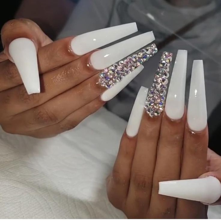 Chic White Acrylic Nails Adorned with Multi-Colored Rhinestones for Glamorous Elegance.