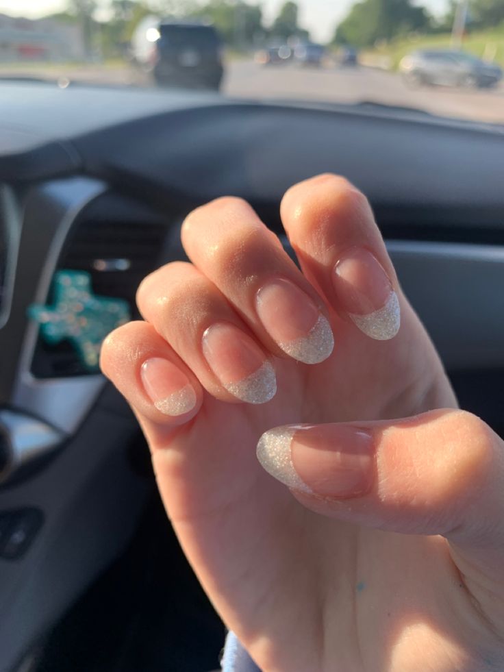 Elegant and Playful Glittery French Tip Nails for Versatile Styling.