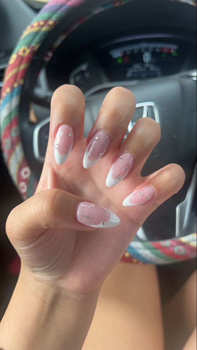 Sophisticated Nail Design: Soft Pink and White Tips with Glamorous Rhinestones