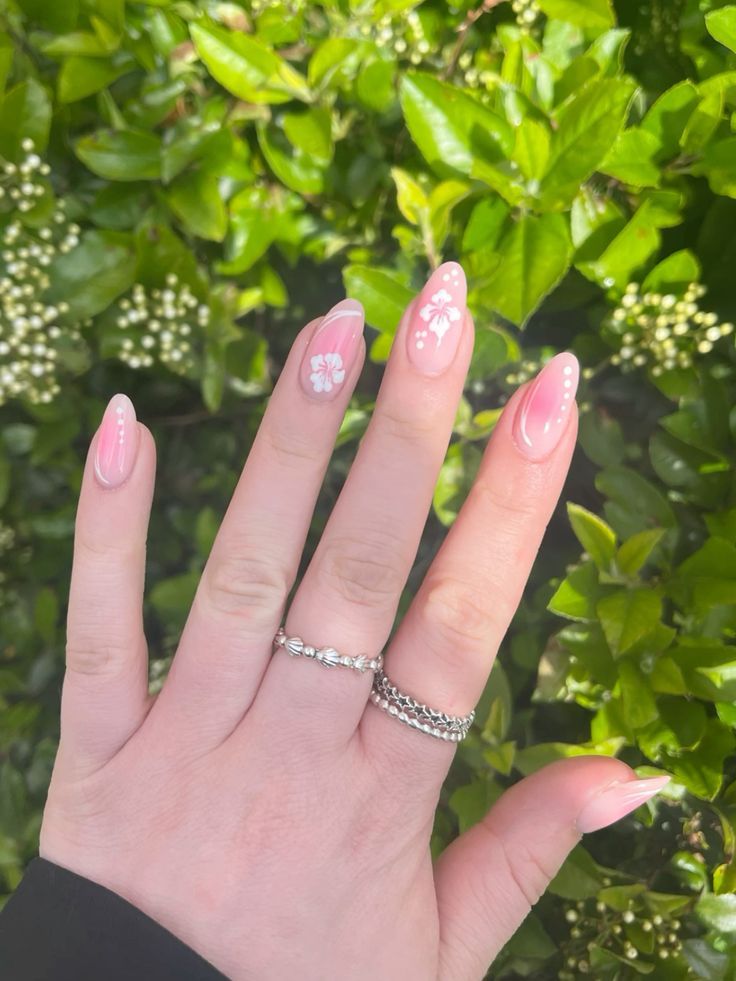 Charming Floral Pink Nail Art: A Playful Touch of Spring Elegance.