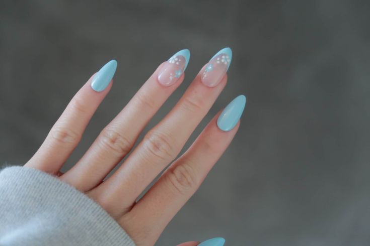 Trendy Stiletto Nails with Playful Blue and Elegant Pink Dot Design.