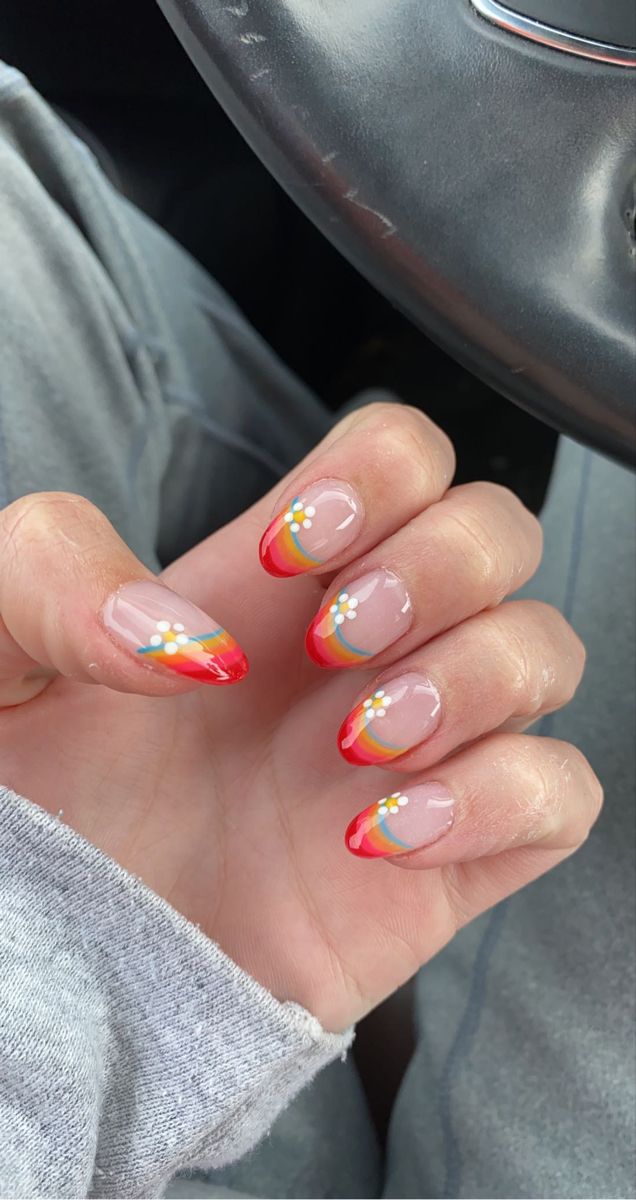 Playful Sunset Gradient Nail Design with Whimsical Floral and Rainbow Accents.