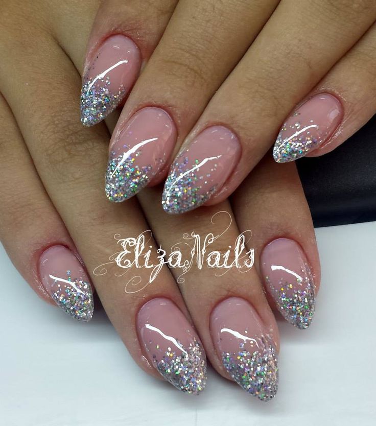 Elegant Glittery French Tips on Almond-Shaped Nails: A Glamorous Design for Any Occasion.