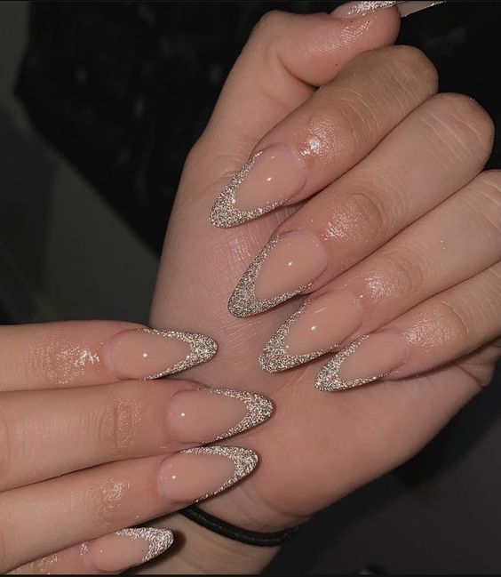 Elegant Almond-Shaped Nails with Nude Base and Sparkling Silver Tips