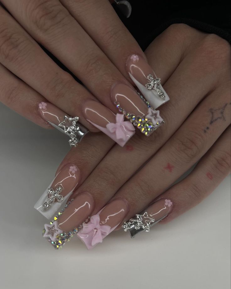 Whimsical Glamour: Elegant Long Acrylic Nail Design with Playful Pastel Accents and Sophisticated Tips.