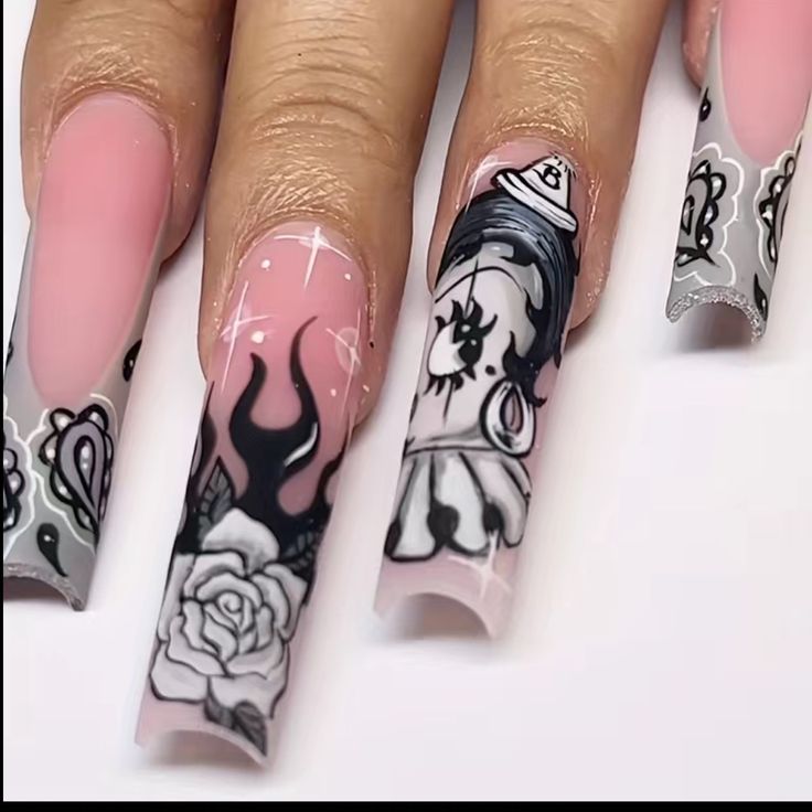 Elegant Nail Art: Intricate Black Designs on Soft Pink with Floral and Flame Motifs.