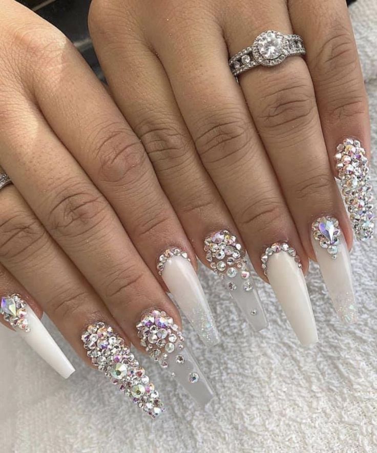 Elegant Elongated Nail Design with Rhinestones and Gradient Accents for Special Occasions.