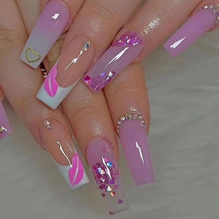 Chic Elegant Pink Gradient Nail Design with Playful Embellishments