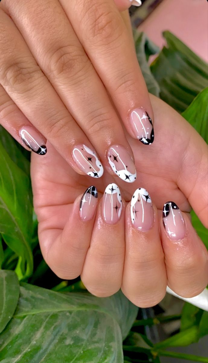 Chic Black-and-White Nail Design with Geometric Elegance and Glossy Finish.